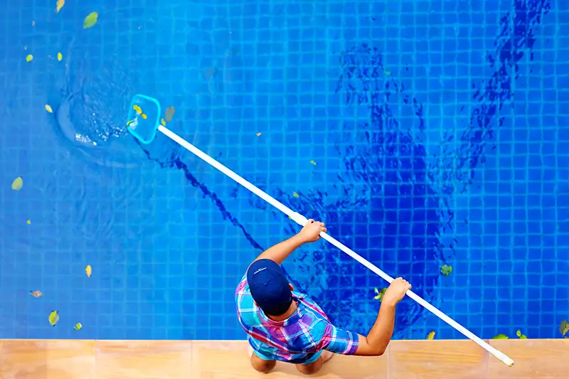 Pool being vacuumed, header image for liner care tips