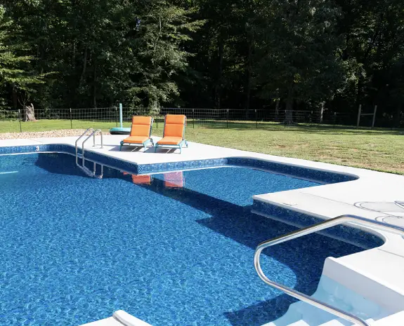 Pool with benches and a sundeck