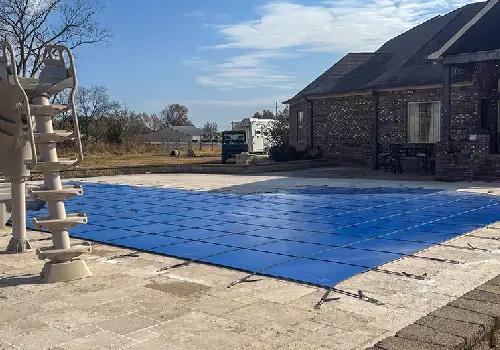 Custom-fit safety cover on a freeform pool