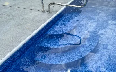 Existing pool steps before a vinyl step upgrade