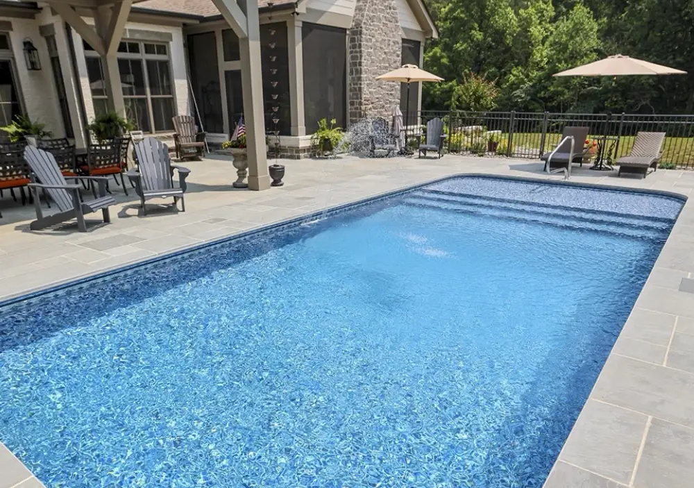 Fully in-ground pool style with a vinyl liner and patio