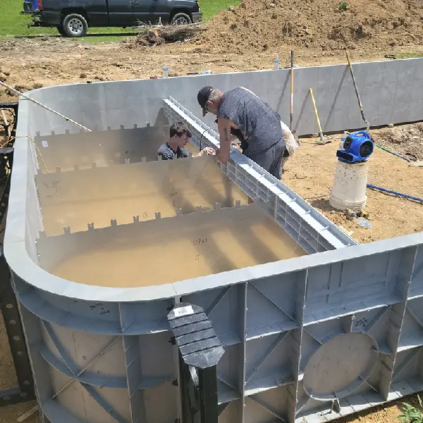 Vinyl pool under construction during installation