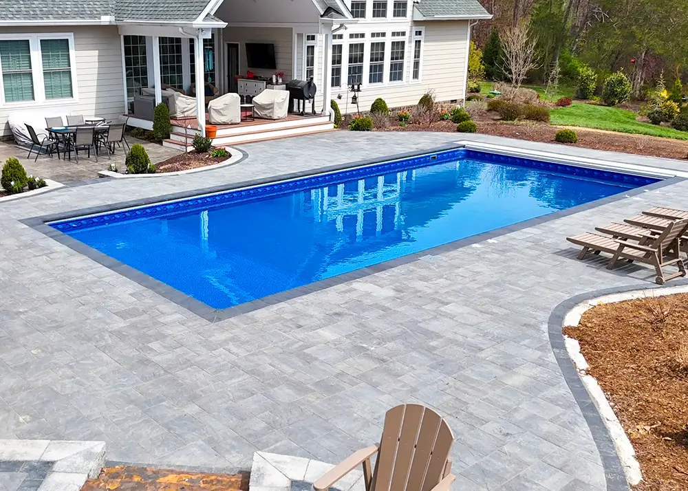 Inground vinyl pool built on a polymer wall system
