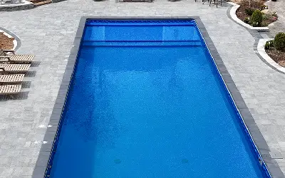 Vinyl-covered pool steps matching the liner pattern
