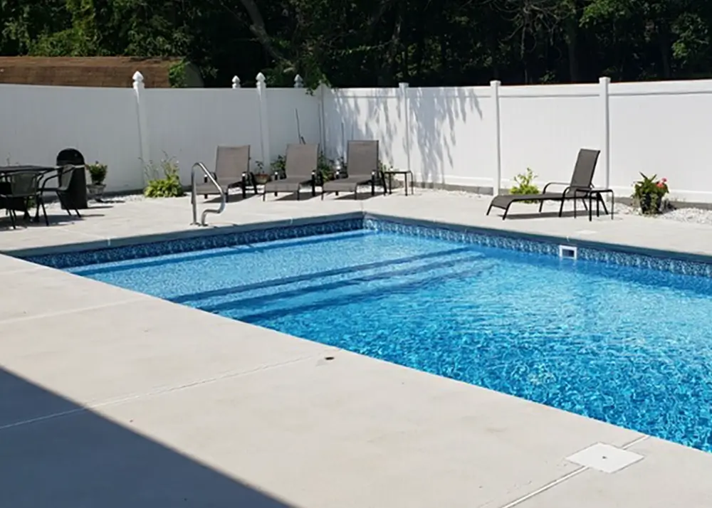 Backyard vinyl pool on a polymer wall system