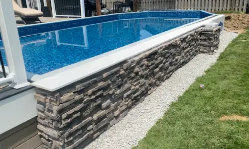 Semi-inground pool installed in rocky ground