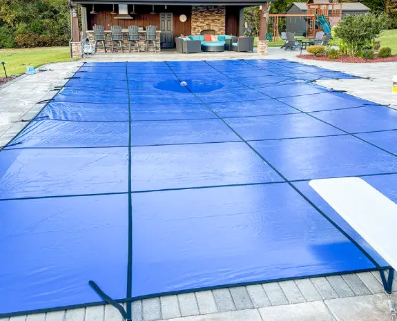 Inground pool with a safety cover