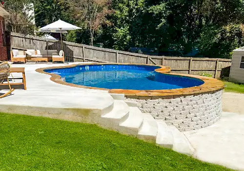 Semi-inground vinyl liner pool with a deck