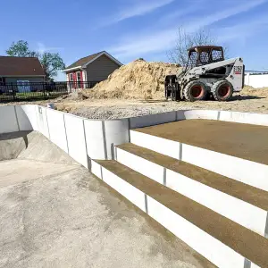 Comparison of steel and polymer pool wall systems