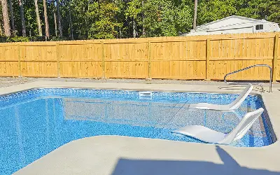 Inground vinyl pool with steps, ledges and benches