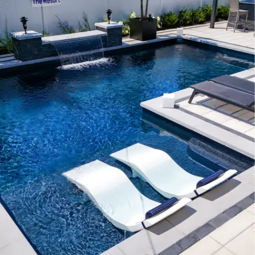 Semi-inground pool with a sundeck and benches