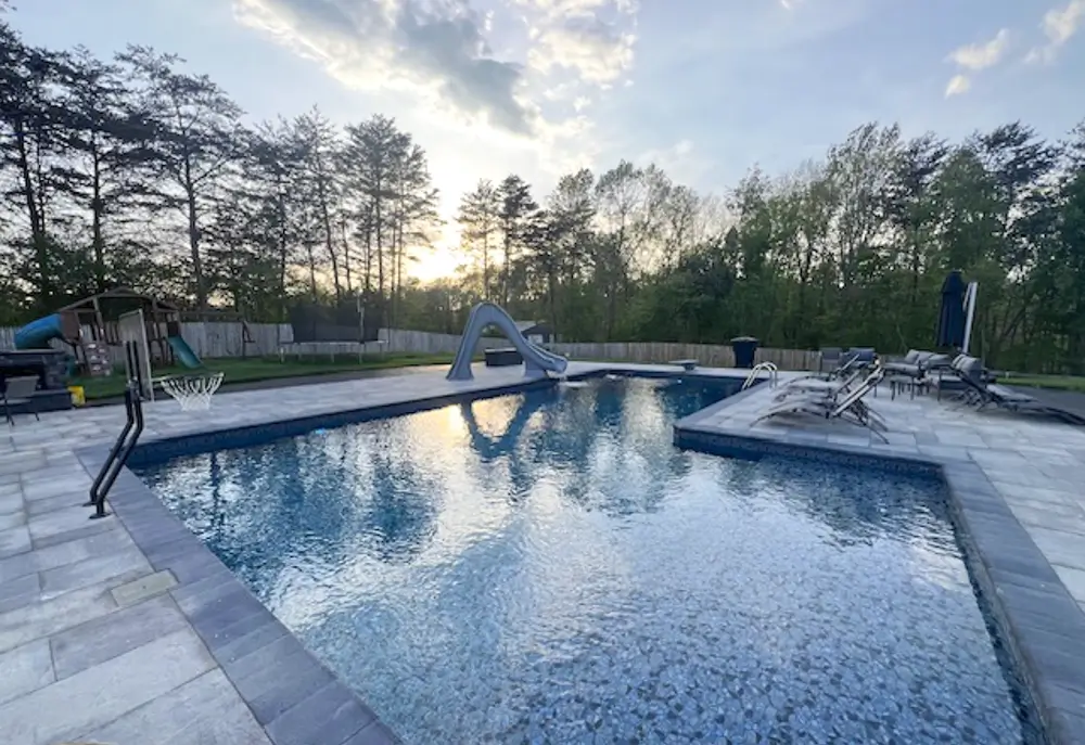 Hydra Pools inground vinyl liner pool bordered by trees