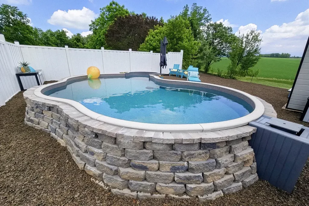 Hydra Pools pool photo — semi-inground lagoon pool — Del Caribe, bullnose thermoform step