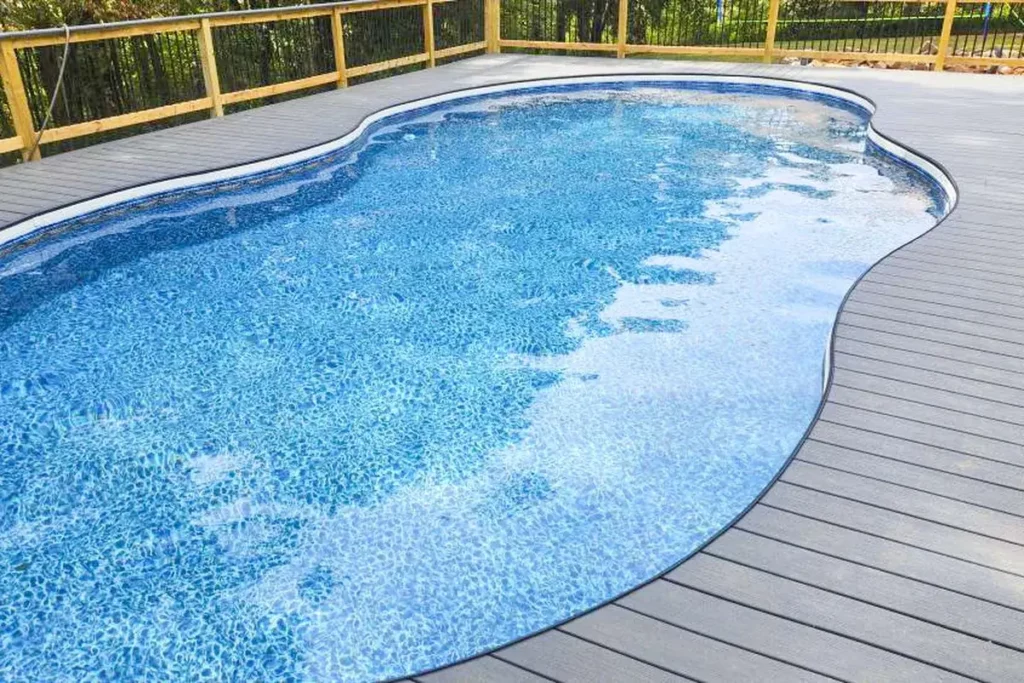Hydra Pools pool photo — semi-inground lagoon pool — Siesta Wave Tan, vinyl covered step