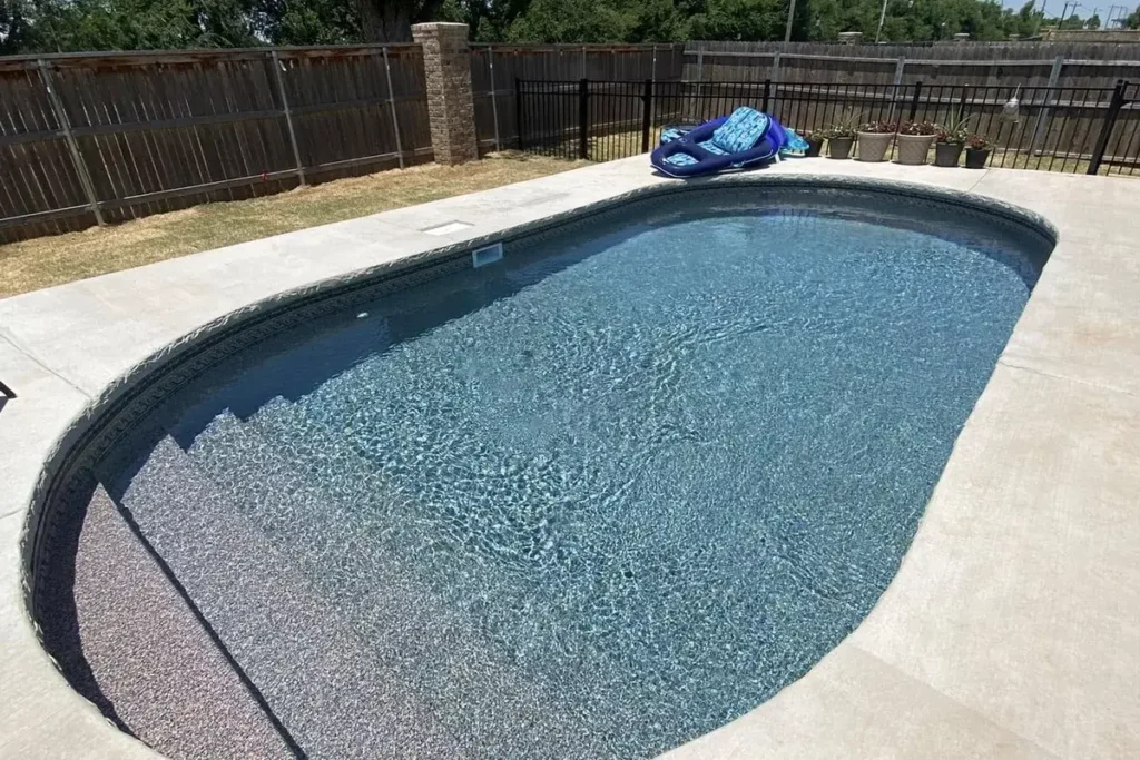 Hydra Pools pool photo — semi-inground oval pool — Del Caribe, vinyl covered step