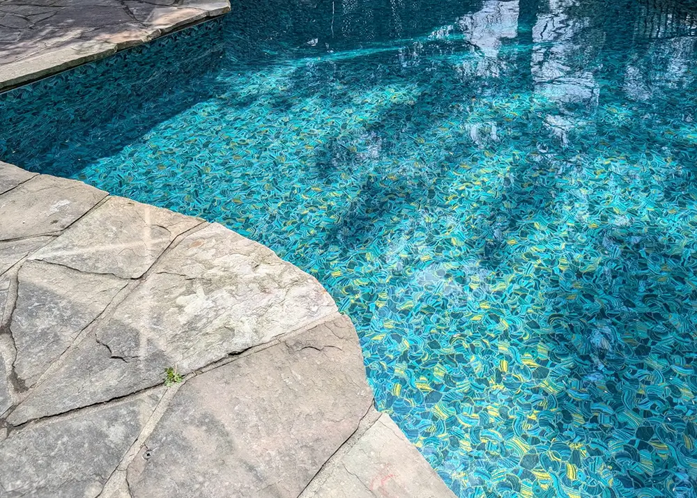 Pool with a Shimmer vinyl liner catching the sunlight