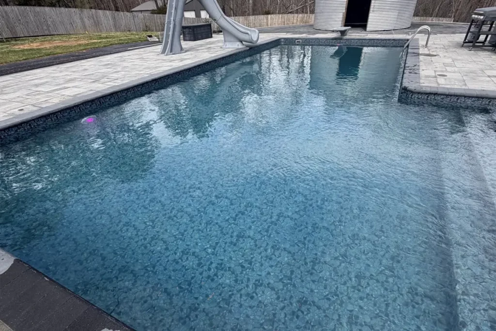 True-L shaped vinyl liner pool with vinyl-covered steps