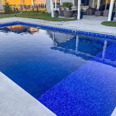 evening photo of Santorini liner in a vinyl lined pool