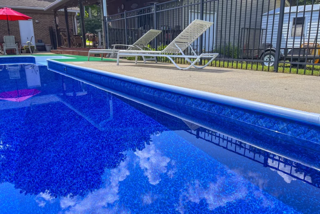 Waterline photo of Prism Cove Brilliant Blue liner pattern in a rectangle swimming pool
