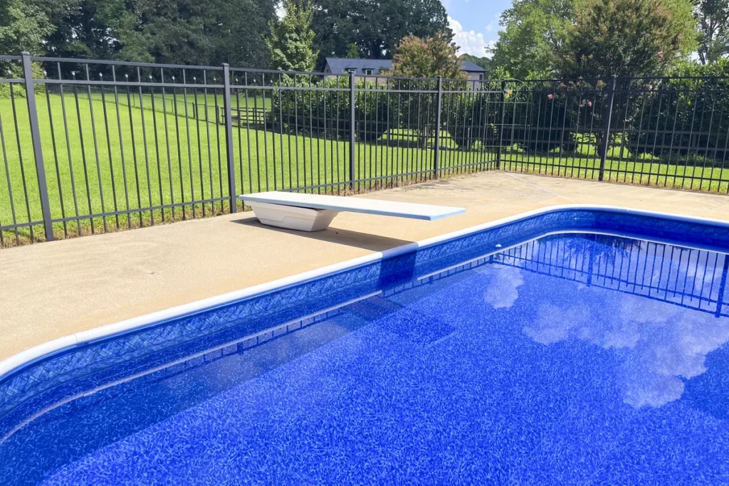 Deep end of vinyl liner swimming pool with Prism Cove Brilliant Blue liner pattern